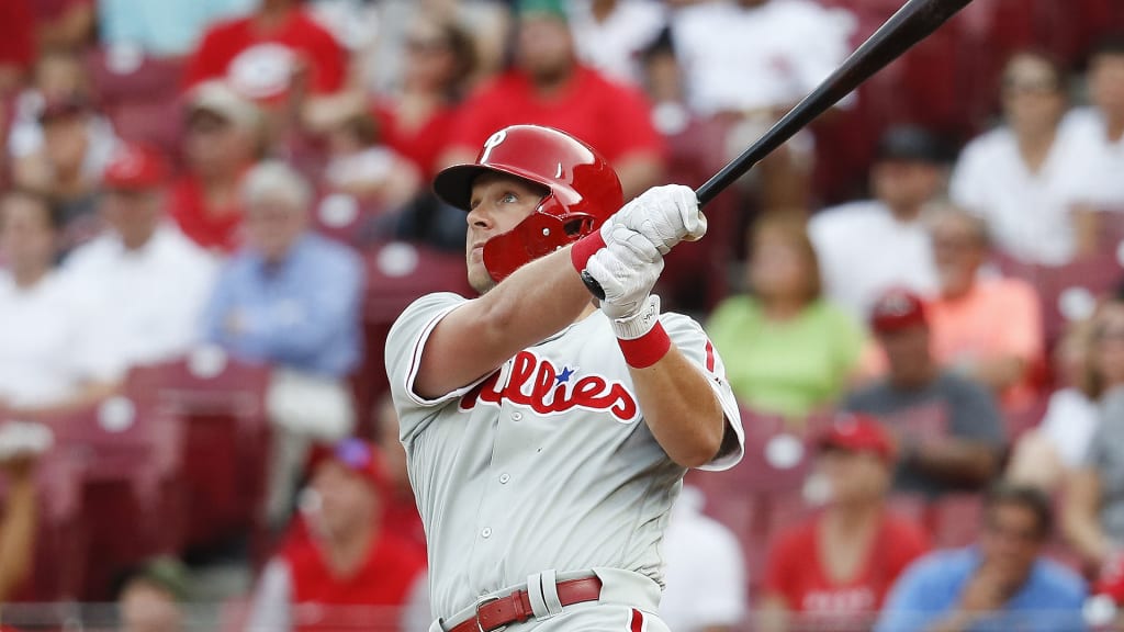 Philadelphia Phillies' Rhys Hoskins hits a solo home run off Cincinnati Reds starting pitcher Tyler Mahle in the first inning of a baseball game, Thursday, July 26, 2018, in Cincinnati. (AP Photo/John Minchillo)