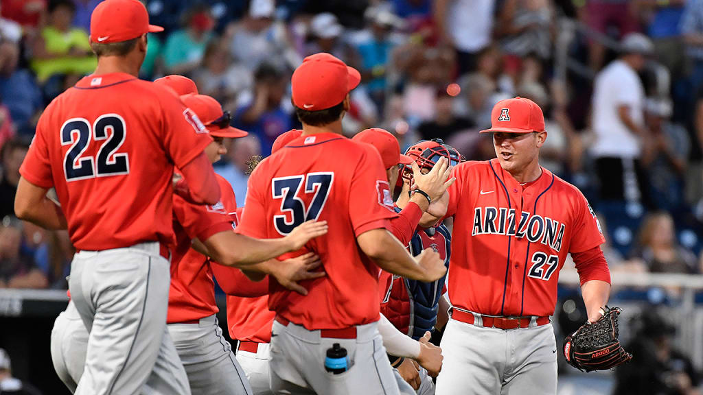 J.C. Cloney (right) is congratulated after his shutout in Monday's College World Series opener. (AP)