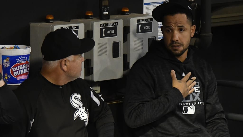 Chicago White Sox manager Rick Renteria, left, and first baseman Jose Abreu, right, talk in the dugout before the team's game against the Cleveland Indians in Chicago on Wednesday, Sept.26, 2018. (AP Photo/Matt Marton)