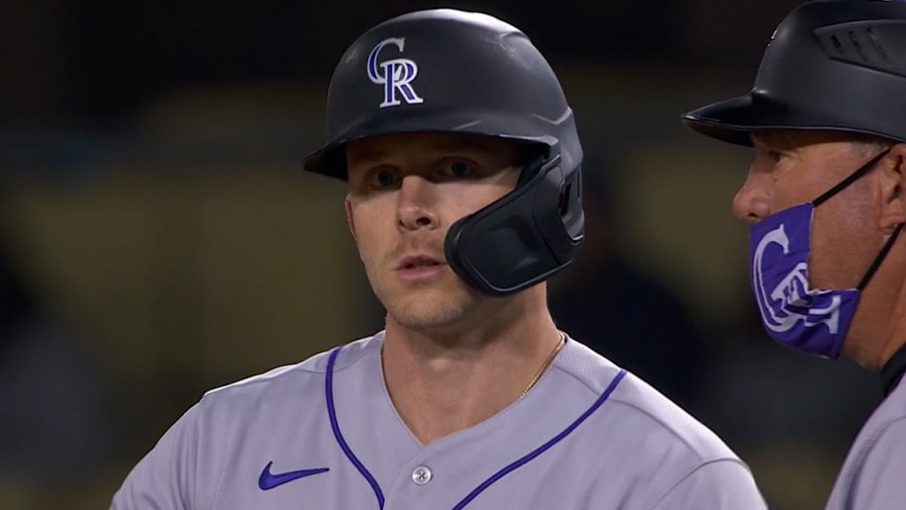 Raimel Tapia of the Colorado Rockies loses his helmet while