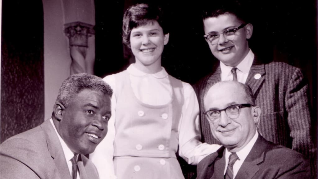 Jackie Robinson and the Rabinovitz family.