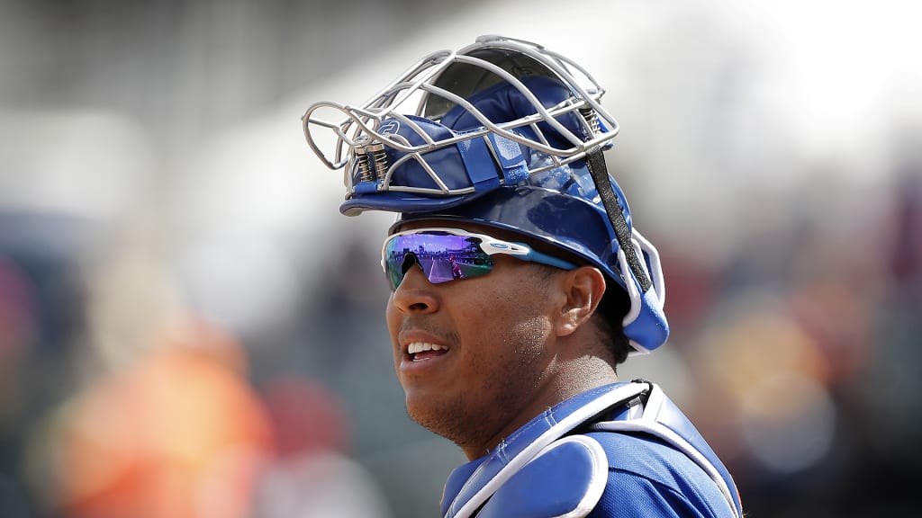Kansas City Royals catcher Salvador Perez gets ready for a pitch during the first inning of a spring training baseball game against the Cincinnati Reds, Wednesday, Feb. 28, 2018, in Surprise, Ariz. (AP Photo/Charlie Neibergall)