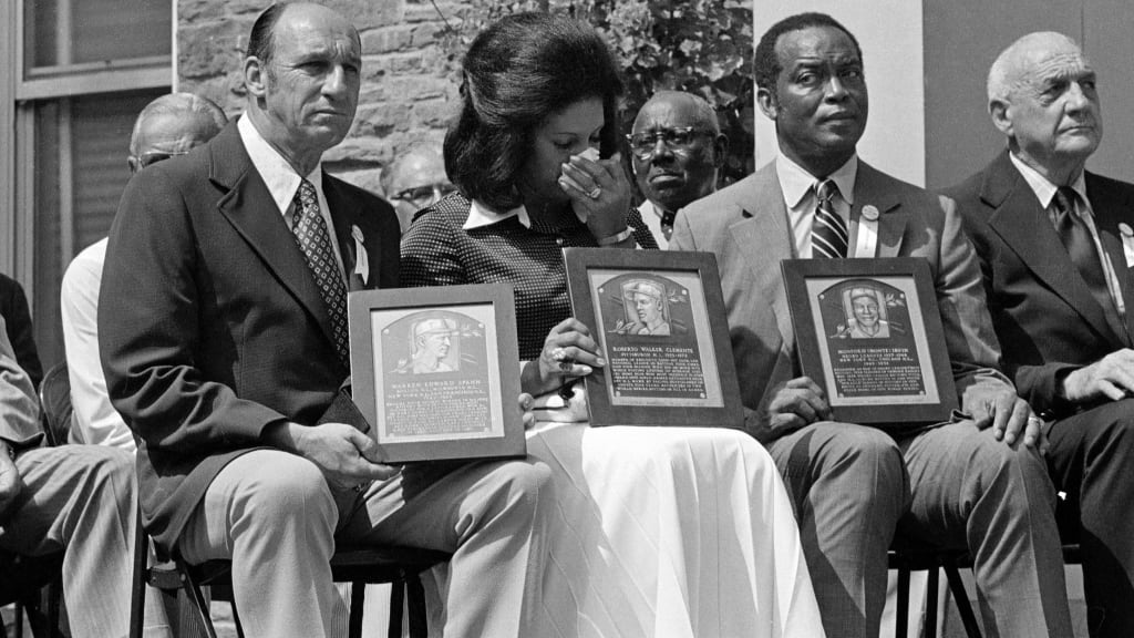 Warren Spahn, Vera Clemente (Roberto's widow) and Monte Irvin at the 1973 Hall of Fame Induction Ceremony.