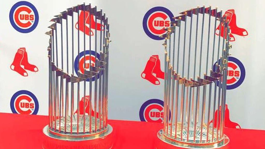 The Red Sox's 2004 World Series trophy and the Cubs' 2016 World Series trophy.