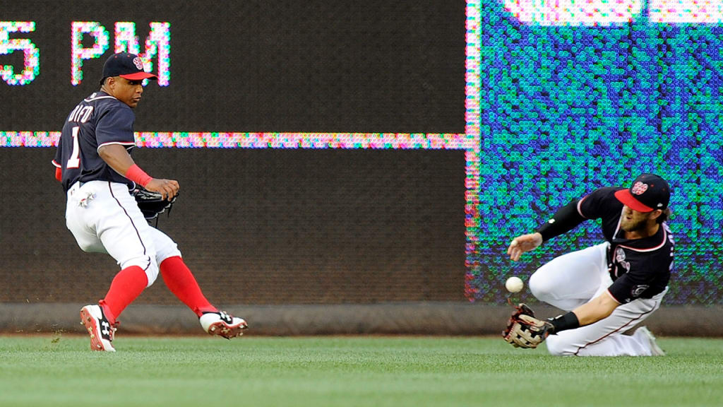 Wilmer Difo watches as Bryce Harper attempts to make a play on a ball that fell in for a double in the first. (Getty)