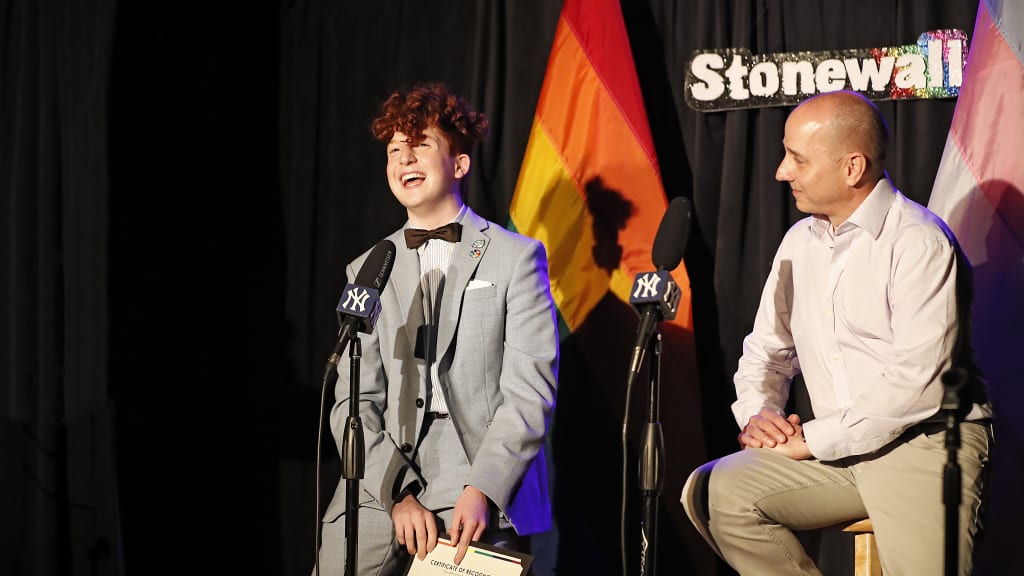 Yankees general manager Brian Cashman introduces the Yankees-Stonewall Scholars recipient Hugh Goldstein.