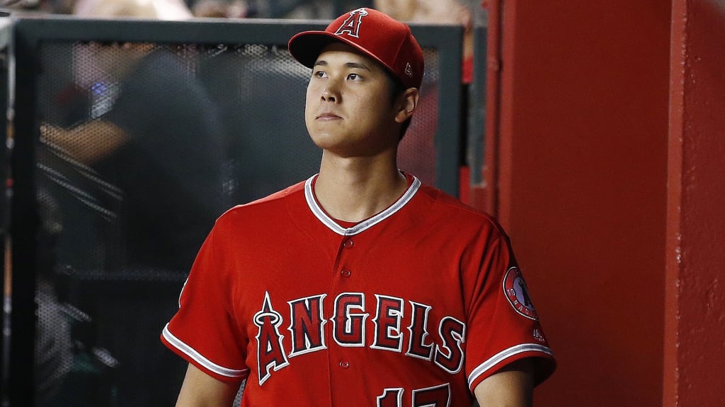 Los Angeles Angels designated hitter Shohei Ohtani, of Japan, walks through the dugout prior to a baseball game against the Arizona Diamondbacks Tuesday, Aug. 21, 2018, in Phoenix. (AP Photo/Ross D. Franklin)