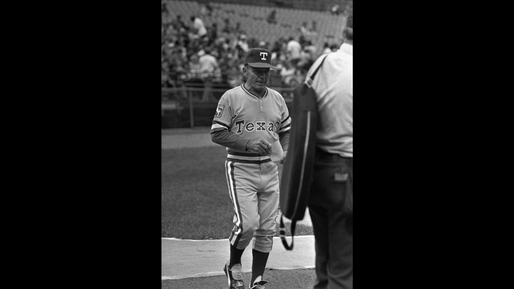 Eddie Stanky brings out the lineup card before his first and only game as manager of the Rangers.