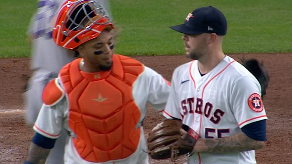 Houston Astros first baseman Aledmys Diaz receives a celebratory massage  from teammates Alex Bregman and Carlos Correa after hitting a three-run  home run against the Oakland Athletics in the 1st inning at