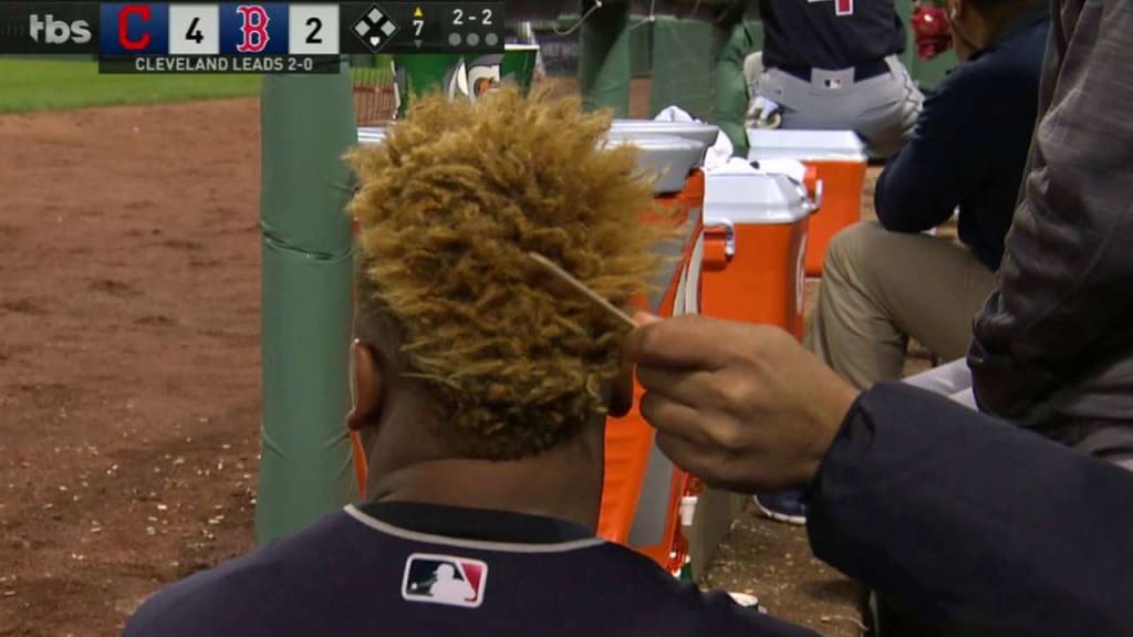 Carrasco combs Ramirez's hair