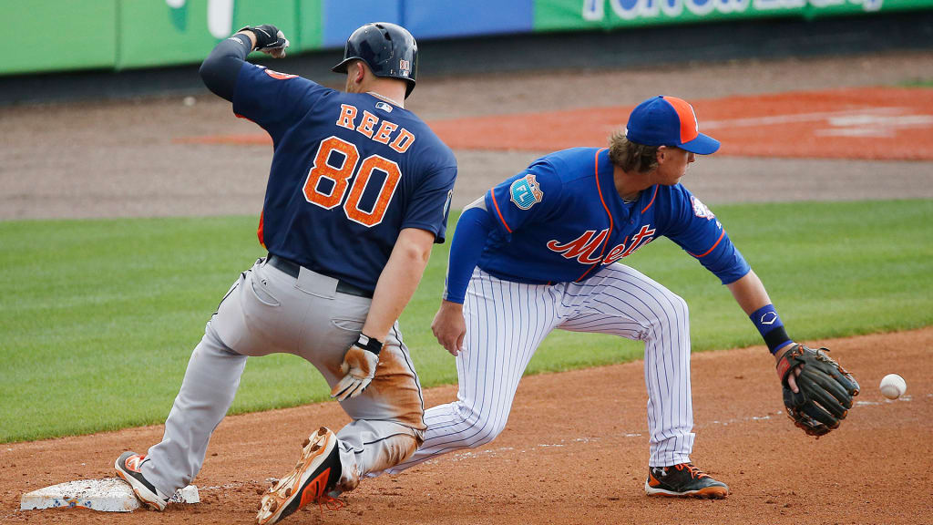 Jeff McNeil of the New York Mets holds three Rawlings gloves