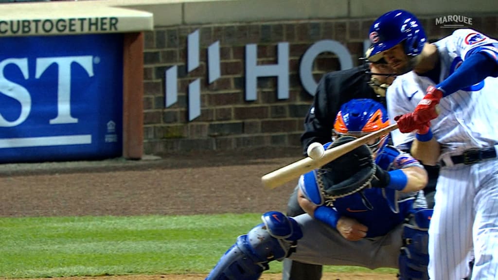 Chicago Cubs shortstop JAVIER BAEZ points to the crowd after hitting a home  run