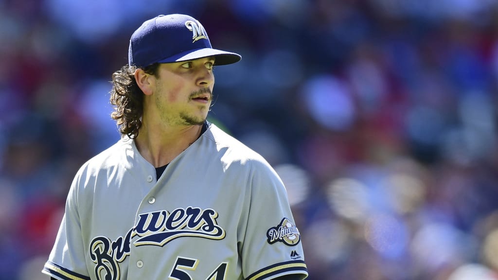Milwaukee Brewers' Taylor Williams walks to the dugout after being relived in the seventh inning of a baseball game against the Cleveland Indians, Wednesday, June 6, 2018, in Cleveland. The Indians won 3-1. (AP Photo/David Dermer)