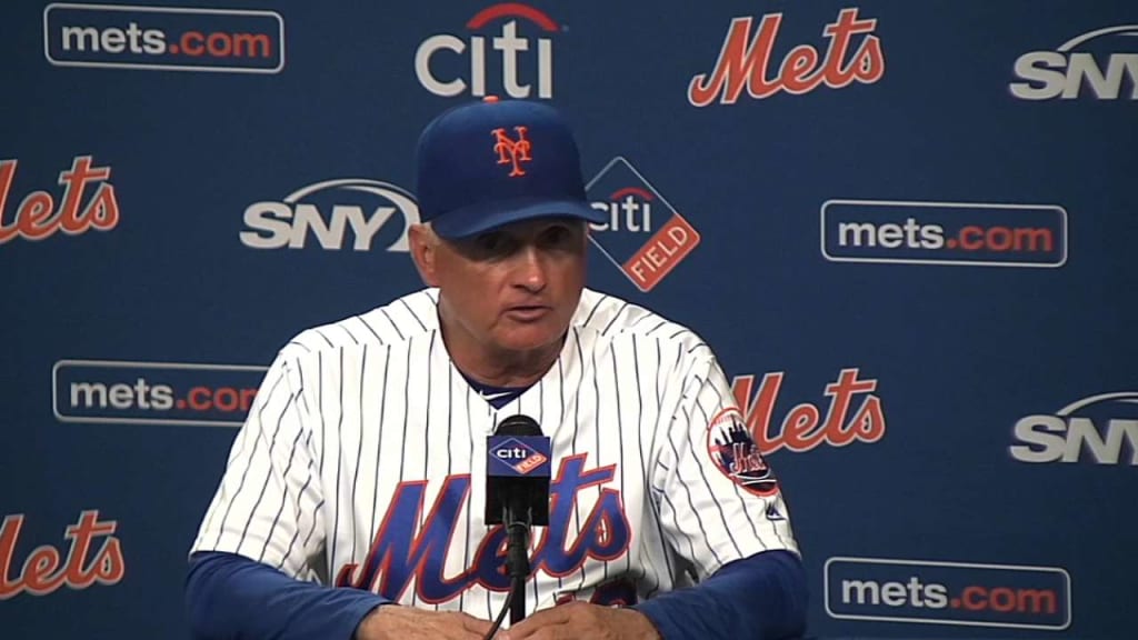 New York Mets manager Terry Collins, left, pulls relief pitcher