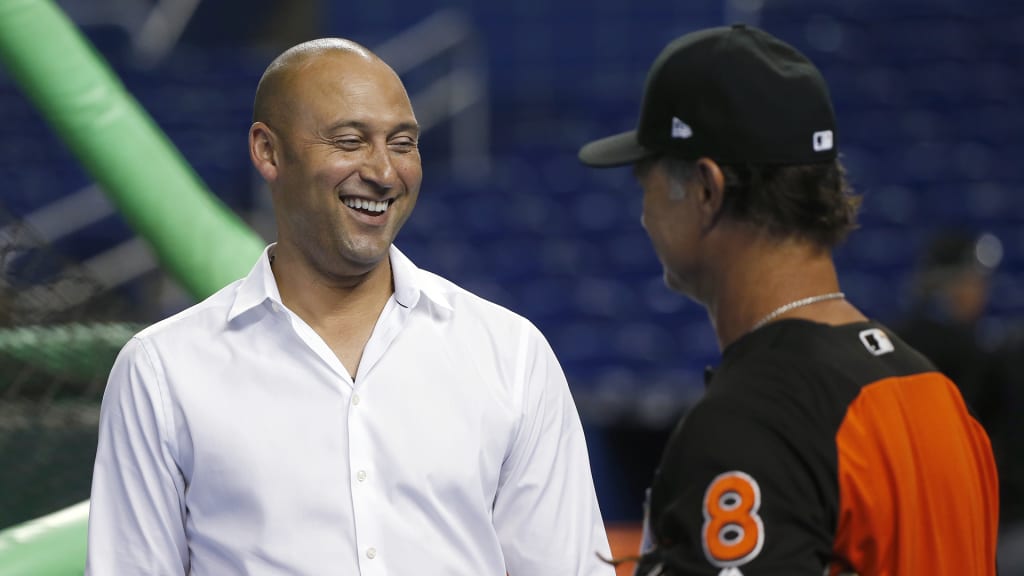 Miami Marlins CEO Derek Jeter, left, laughs as he talks with manager Don Mattingly during batting practice before the team's baseball game against the Arizona Diamondbacks, Wednesday, June 27, 2018, in Miami. (AP Photo/Wilfredo Lee)