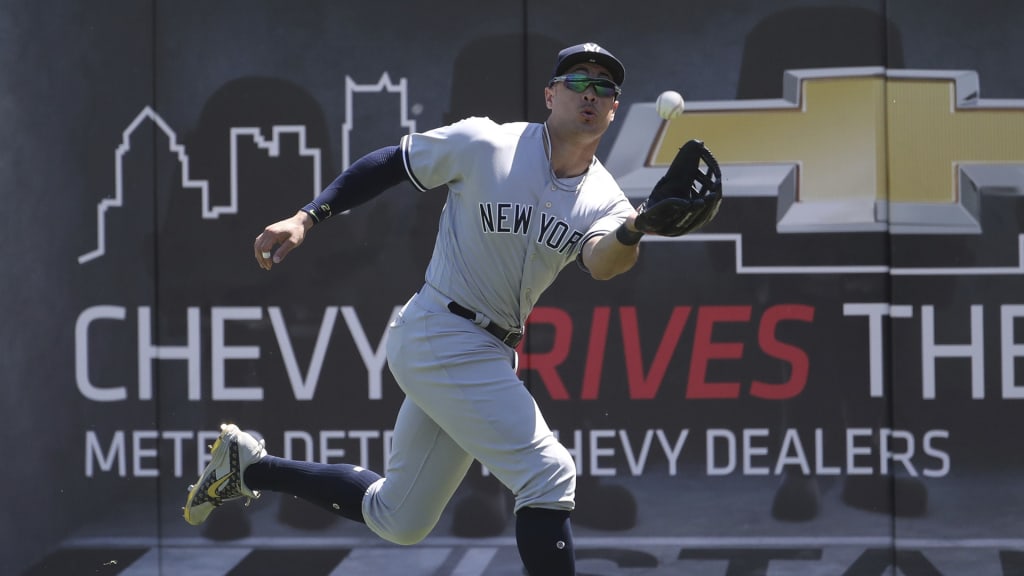 New York Yankees right fielder Giancarlo Stanton catches the fly-out hit by Detroit Tigers' Jose Iglesias during the seventh inning of the first game of a baseball doubleheader, Monday, June 4, 2018, in Detroit. (AP Photo/Carlos Osorio)
