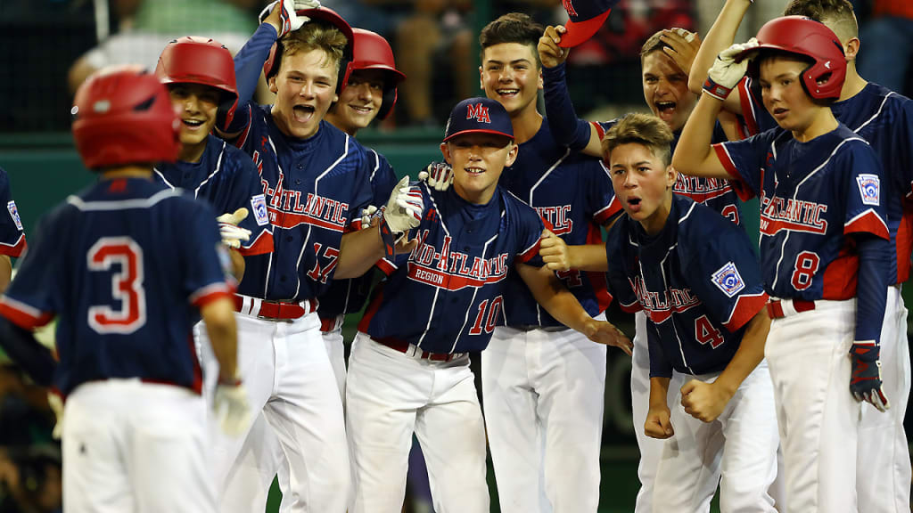 Jude Abbadessa is greeted by his N.Y. teammates after hitting a two-run home run in the second inning. (Alex Trautwig/MLB)