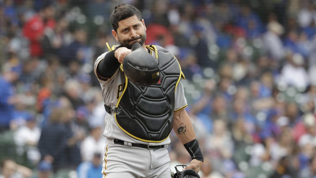Pittsburgh Pirates catcher Francisco Cervelli signals to his teammates at the start of a baseball game against the Chicago Cubs Friday, June 8, 2018, in Chicago. (AP Photo/Charles Rex Arbogast)