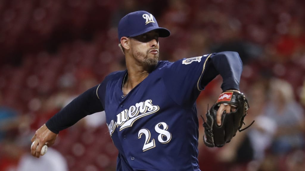Milwaukee Brewers starting pitcher Jorge Lopez throws in the ninth inning of a baseball game against the Cincinnati Reds, Thursday, June 29, 2017, in Cincinnati. The Brewers won 11-3. (AP Photo/John Minchillo)