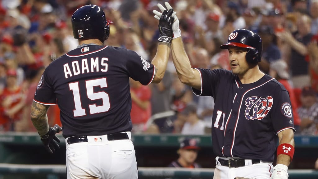 Washington Nationals' Matt Adams (15) is greeted by teammate Ryan Zimmerman (11) after hitting a two-run home run off Philadelphia Phillies starting pitcher Nick Pivetta during the second inning of a baseball game at Nationals Park, Friday, May 4, 2018, in Washington. (AP Photo/Pablo Martinez Monsivais)