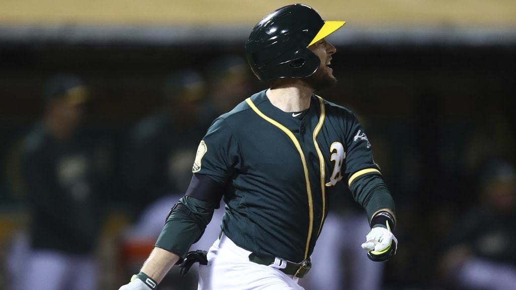 Oakland Athletics' Jed Lowrie drops his bat after hitting a two-run double off Los Angeles Angels' Felix Pena during the fourth inning of a baseball game Wednesday, Sept. 19, 2018, in Oakland, Calif. (AP Photo/Ben Margot)