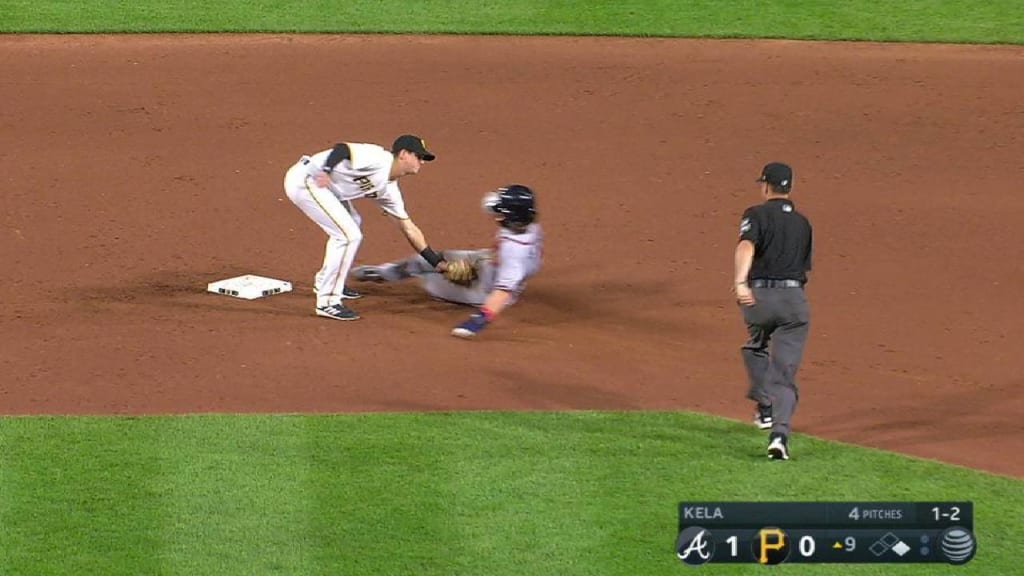 Pittsburgh Pirates catcher Steven Baron falls into the Minnesota