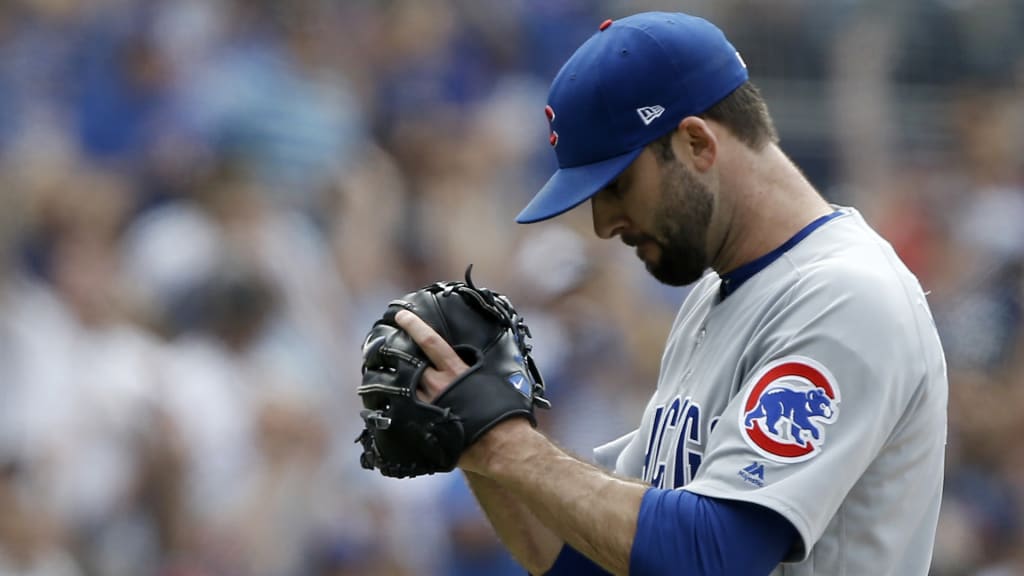 Chicago Cubs relief pitcher Brandon Morrow reacts by clapping his hand to his glove after striking out San Diego Padres Eric Hosmer during the ninth inning of a baseball game in San Diego, Sunday, July 15, 2018. (AP Photo/Alex Gallardo)