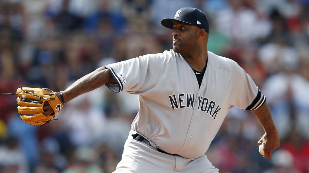 Milwaukee Brewers starting pitcher CC Sabathia catches a ball