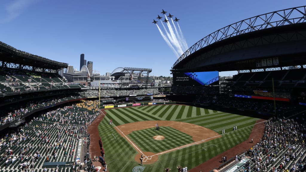 Members of the U.S. Navy Blue Angels fly in formation over T-Mobile Park when the Mariners are in town during Seafair weekend.