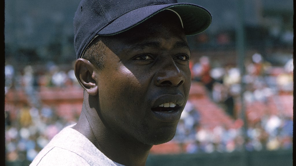 Hank Aaron sitting next to some old man named Satchel Paige : r