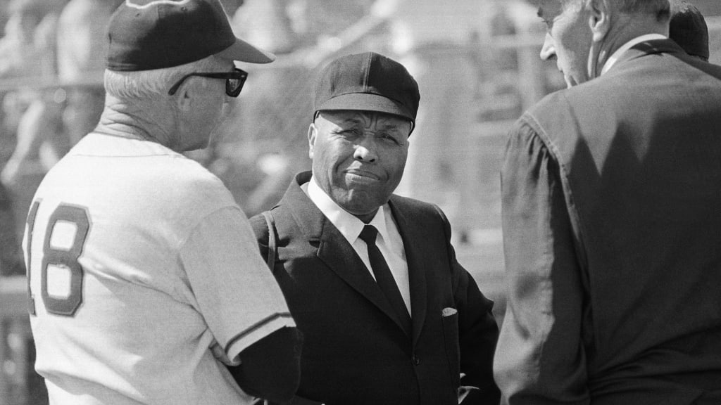 Umpire mask worn by Emmett Ashford. Emmett Ashford was the first African  American umpire in Major League Baseball (MLB). Ashford umped from  1966-1970 and was known for his animated calls and dress.