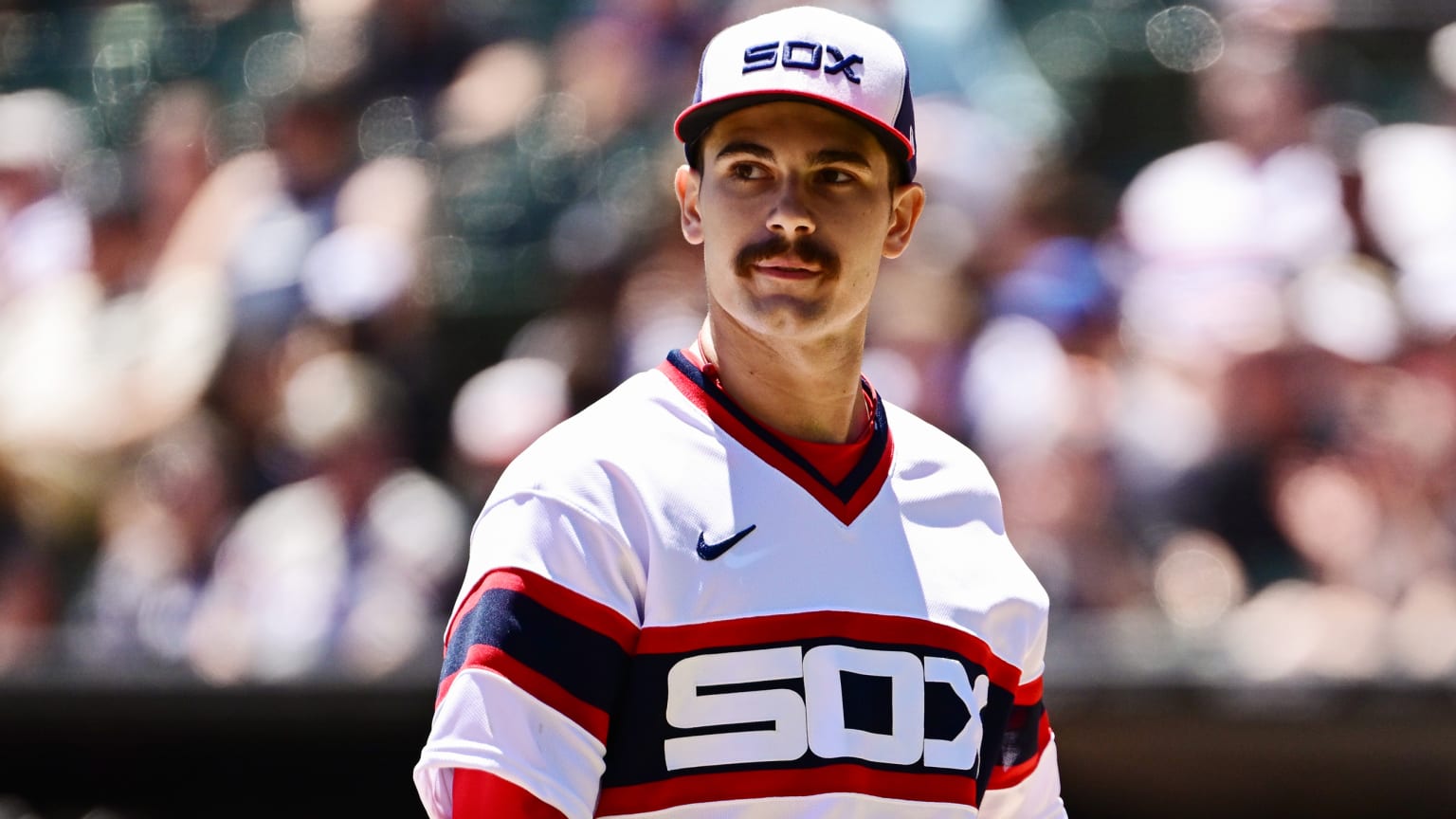 Dylan Cease on a sunny afternoon in a red, white and blue jersey that says ''SOX'' across the chest