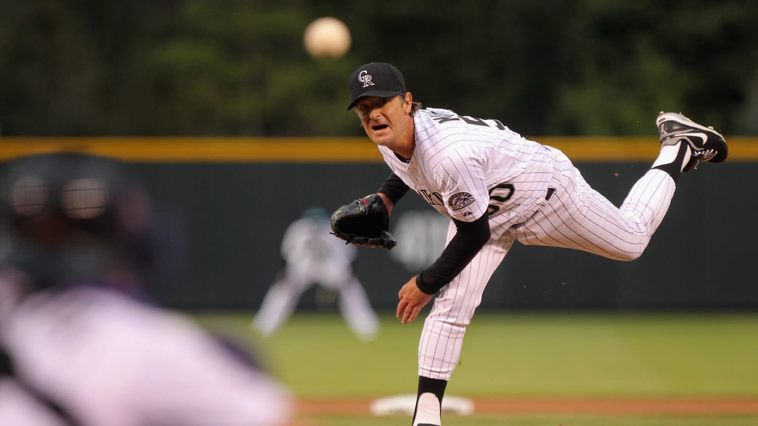 Jamie Moyer follows through on a pitch for the Rockies