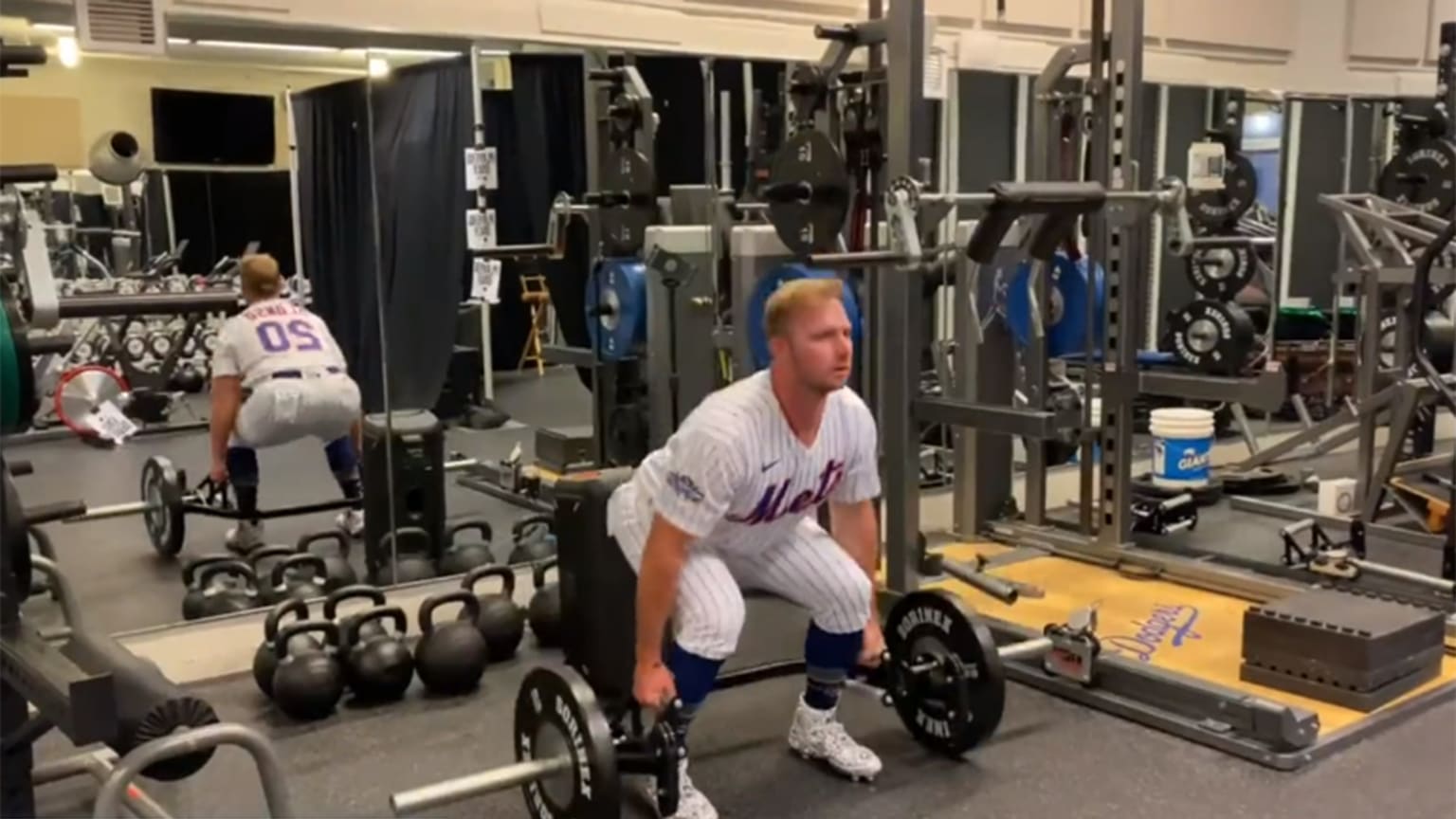 Pete Alonso lifting weights in uniform