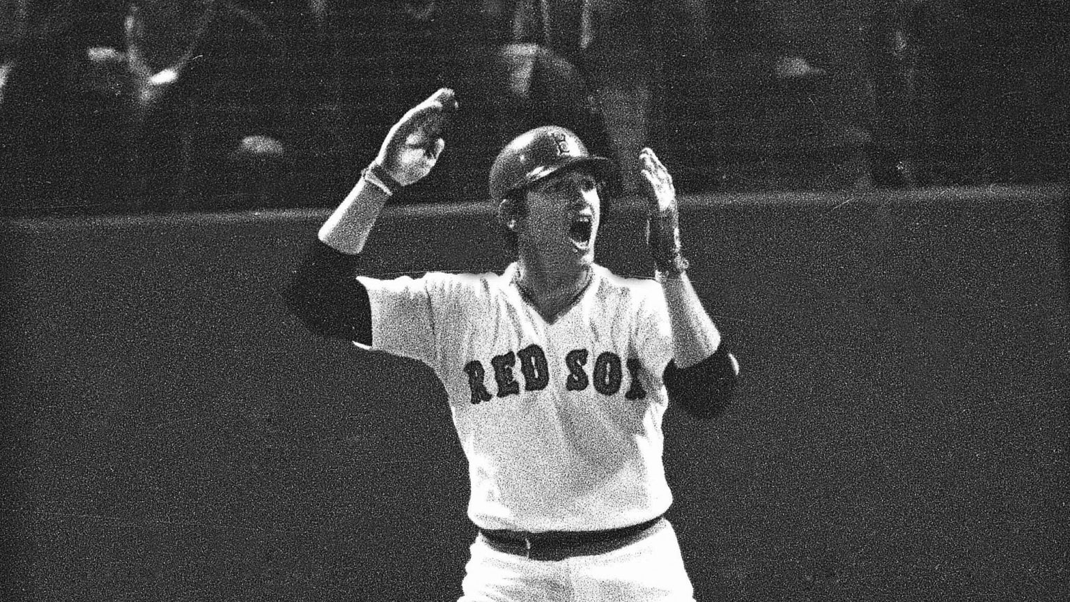Carlton Fisk waves his arms, imploring his historic home run in the 1975 World Series to stay fair