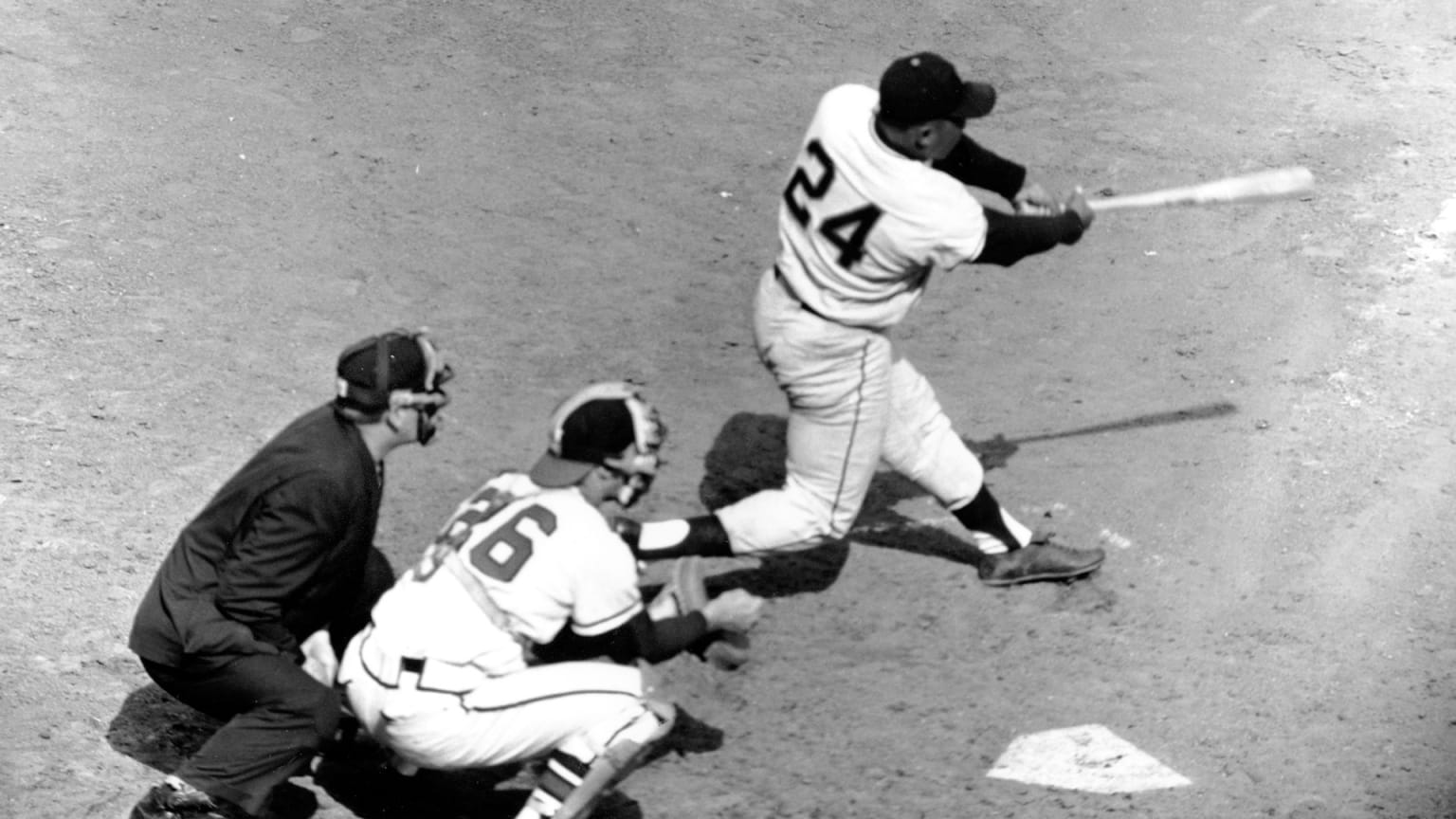 Willie Mays swings at a pitch