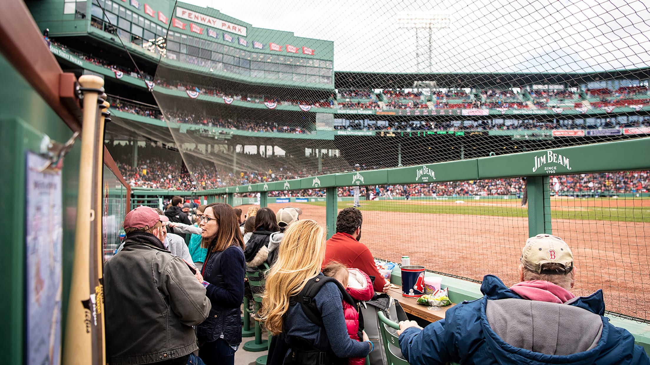 Boston Red Sox install green tents for extra Fenway Park dugout