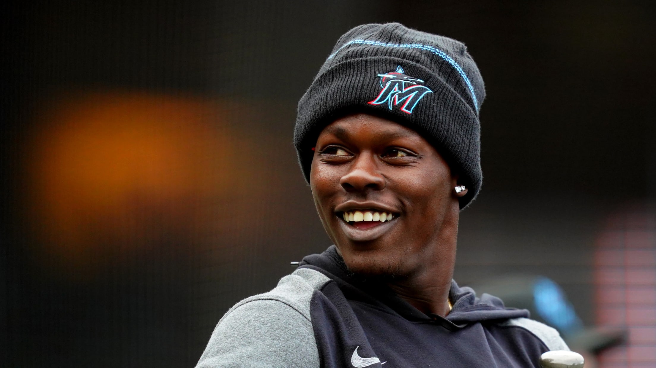 Miami Marlins second baseman Jazz Chisholm Jr. wears a bandana and shirt  with the colors of the Bahamian flag before a baseball game against the  Colorado Rockies, Tuesday, June 21, 2022, in