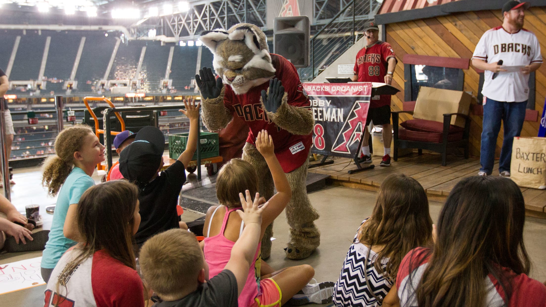 The Wickenburg Sun - Arizona Diamondbacks mascot Baxter rides around the  concourse on a scooter he borrowed from a fan in attendance.