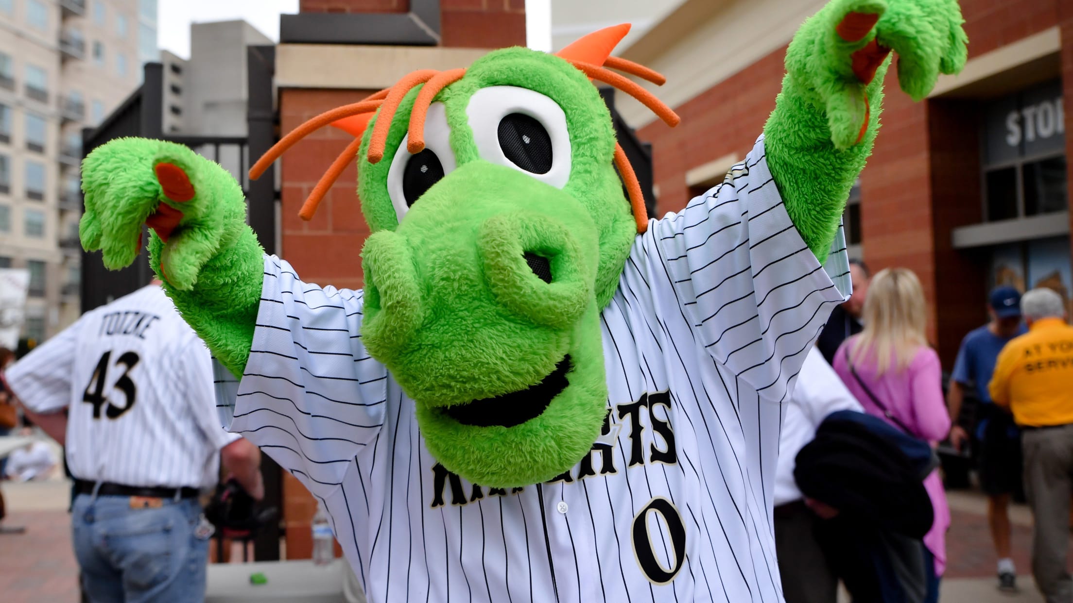 Charlotte Knights mascot Homer the Dragon leads the fans in cheers during  an International League game against the Memphis Redbirds at Truist Field  on April 2, 2023 in Charlotte, North Carolina. (Brian