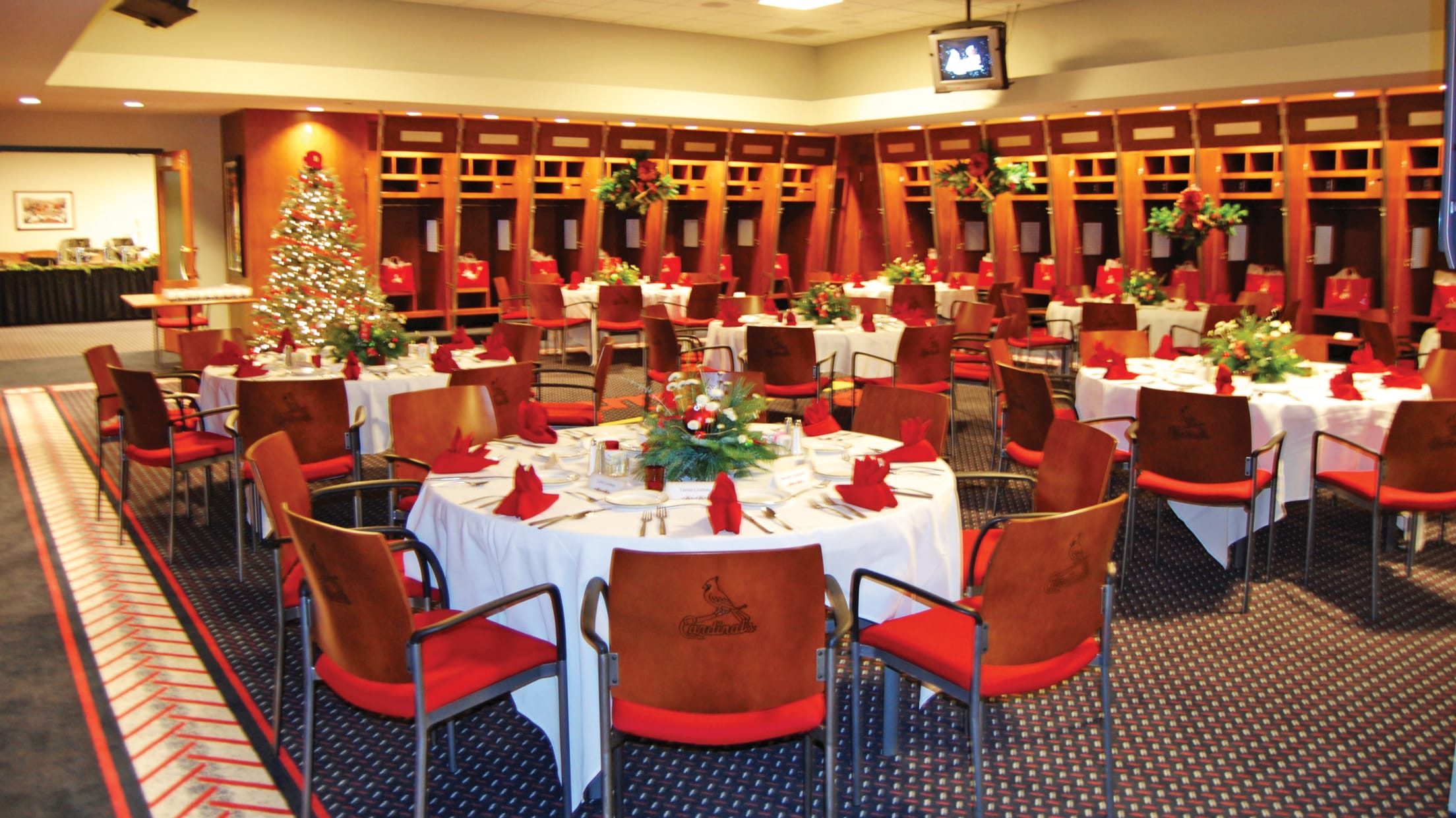 St. Louis Cardinals clubhouse attendant Nate Pfitser wheels in