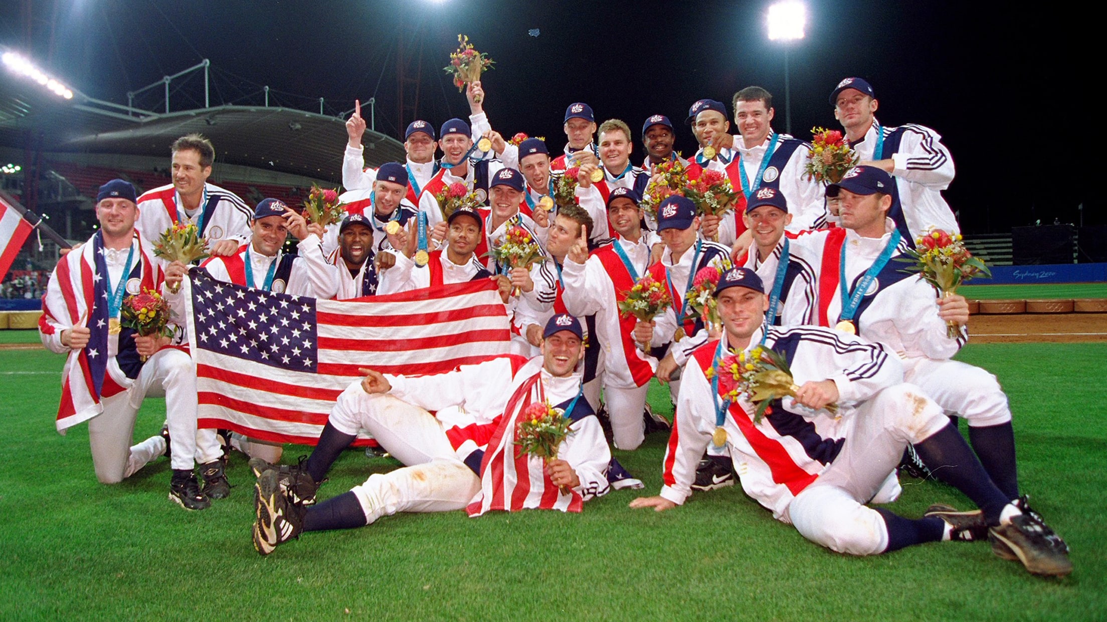 The 2000 USA baseball team celebrates winning Olympic gold