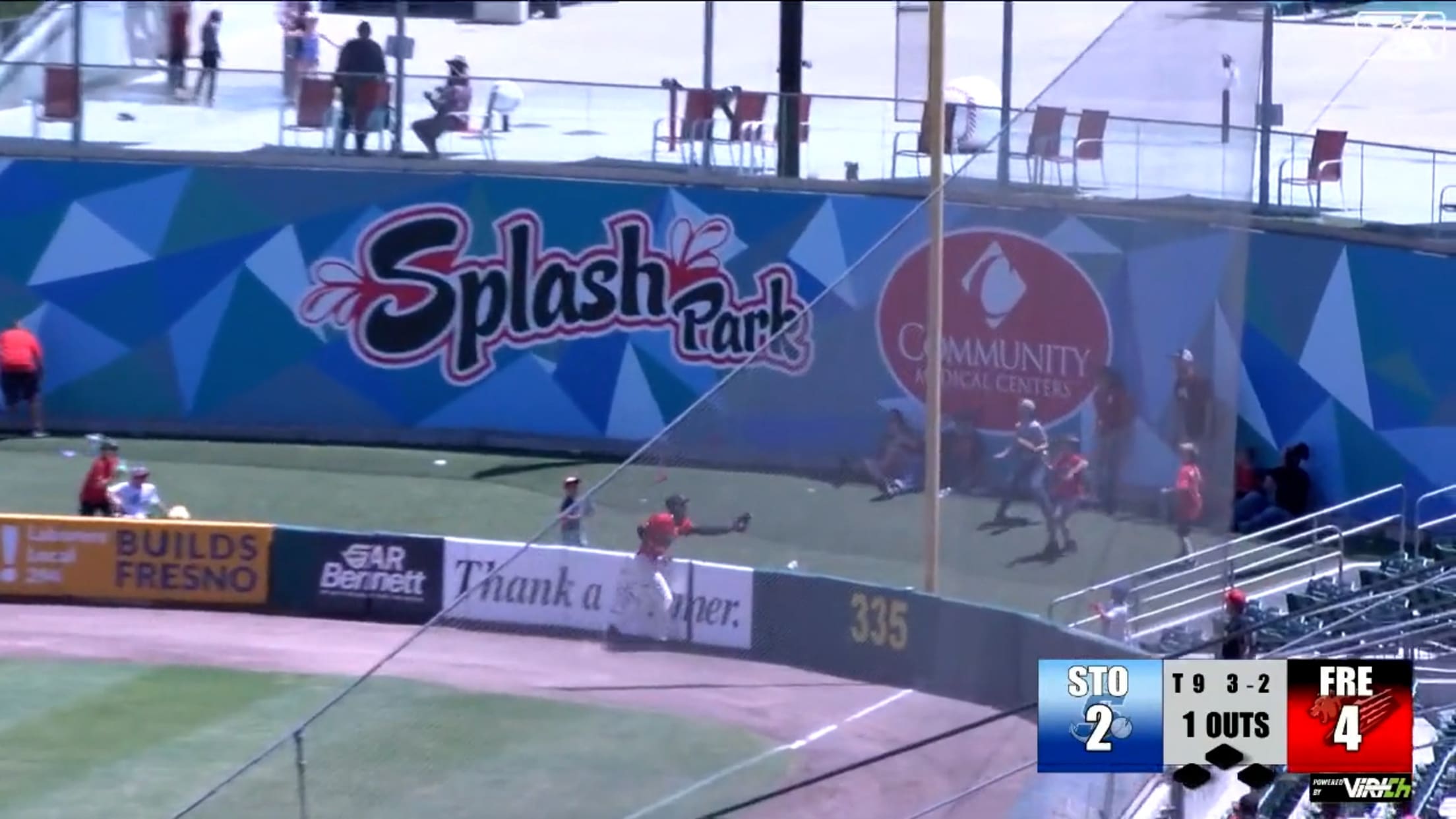 Guerrero goes over wall for catch