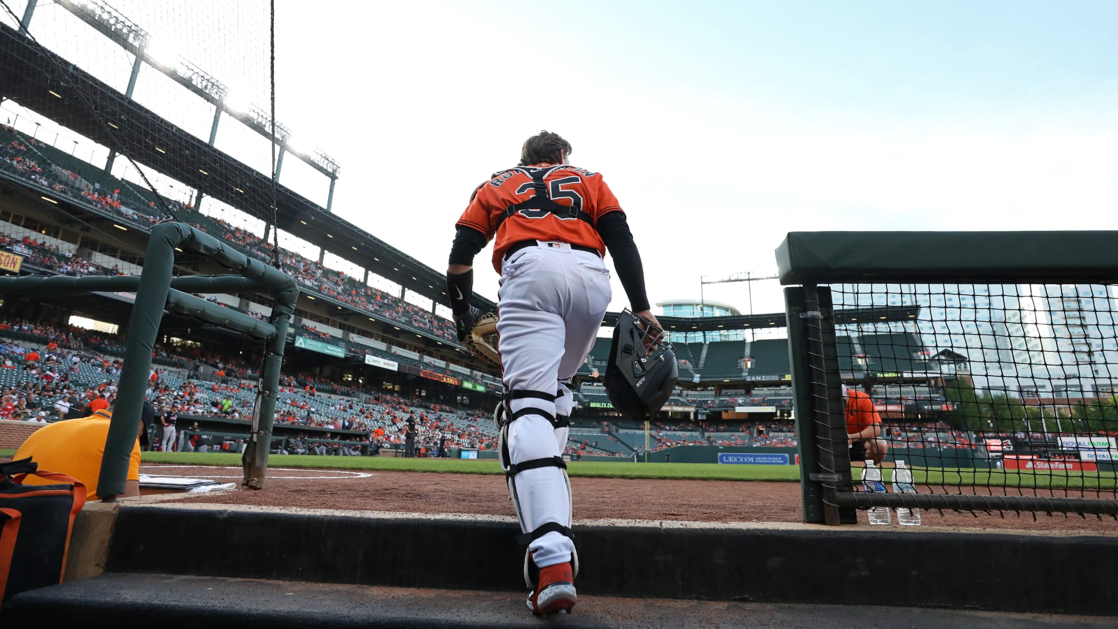 Download Adley Rutschman Swinging For The Baltimore Orioles Wallpaper