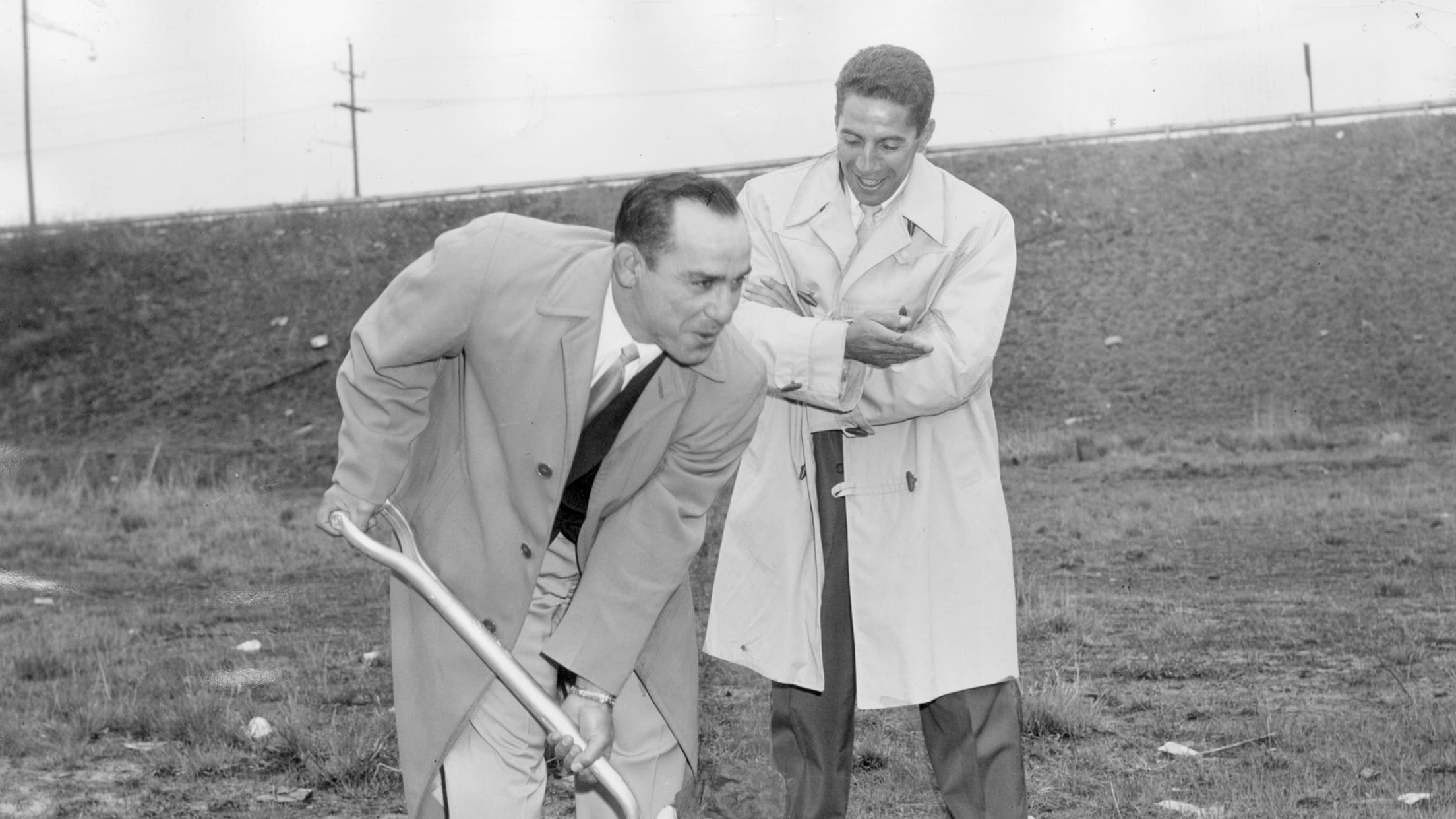 Checking bowling balls, Yogi Berra, left, and Phil Rizzuto work at