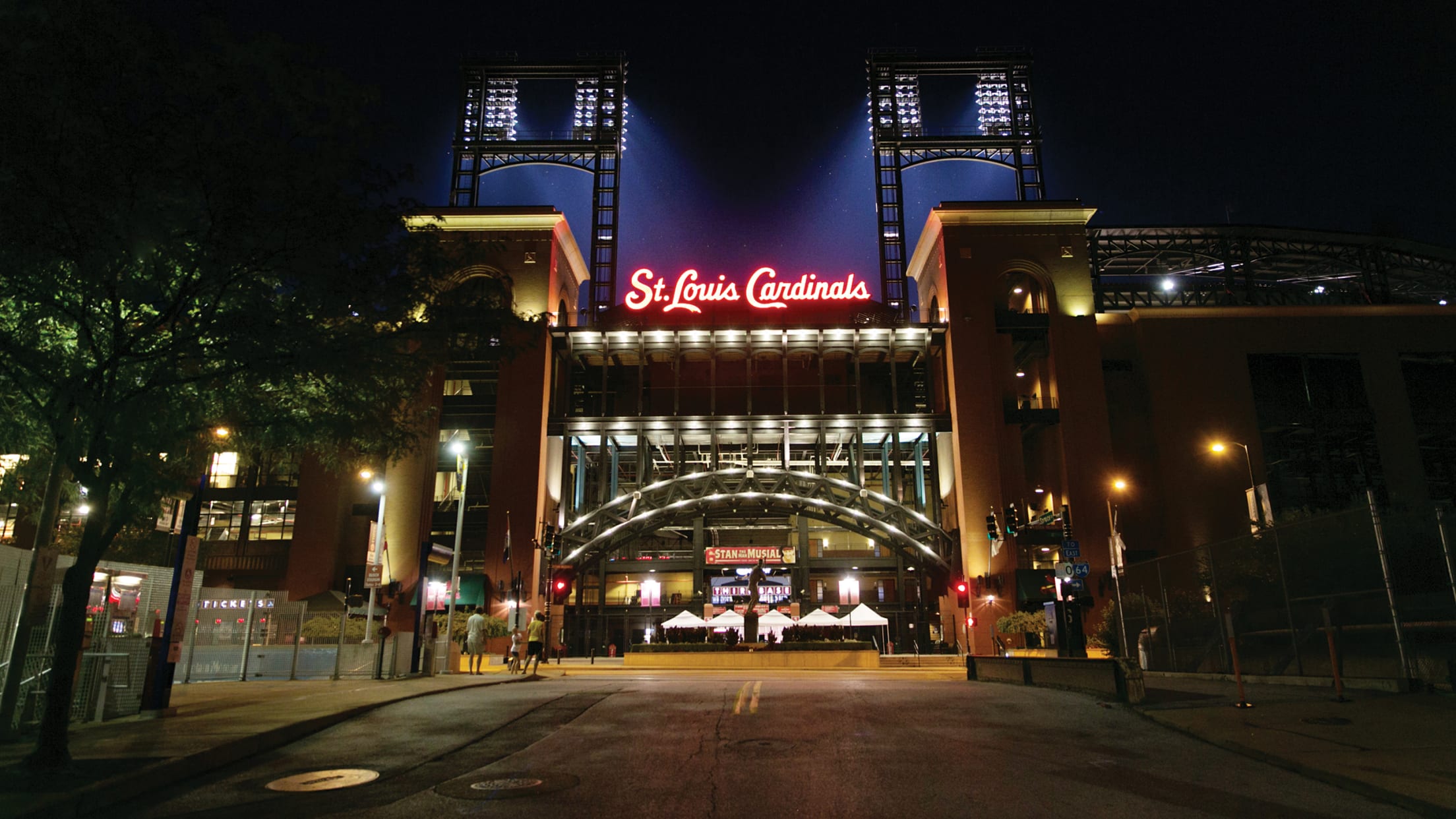 St. Louis Cardinals neon sign with downtown from Busch Stadium