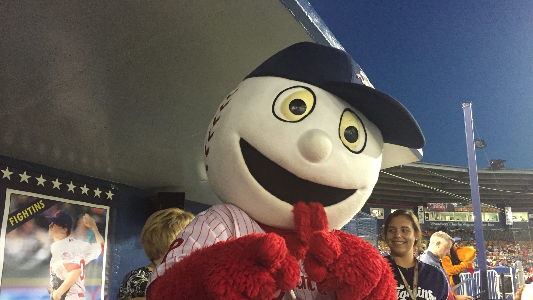 Reading Phils mascot Screwball greets fans in the stands. The New