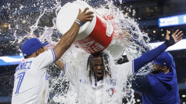 June 4, 2022, Toronto, ON, Canada: Toronto Blue Jays' Teoscar Hernandez,  left, dumps a cooler of water on Vladimir Guerrero Jr (27) following their  victory over the Minnesota Twins in American League