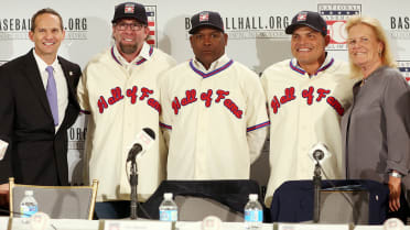 National Baseball Hall of Fame member Ryne Sandberg tips his cap to the  crowd as he is introduced before playing in Play Ball with Ozzie, at  Doubleday Field in Cooperstown, New York