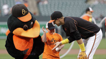 Baltimore Orioles third baseman Manny Machado wears gold cleats